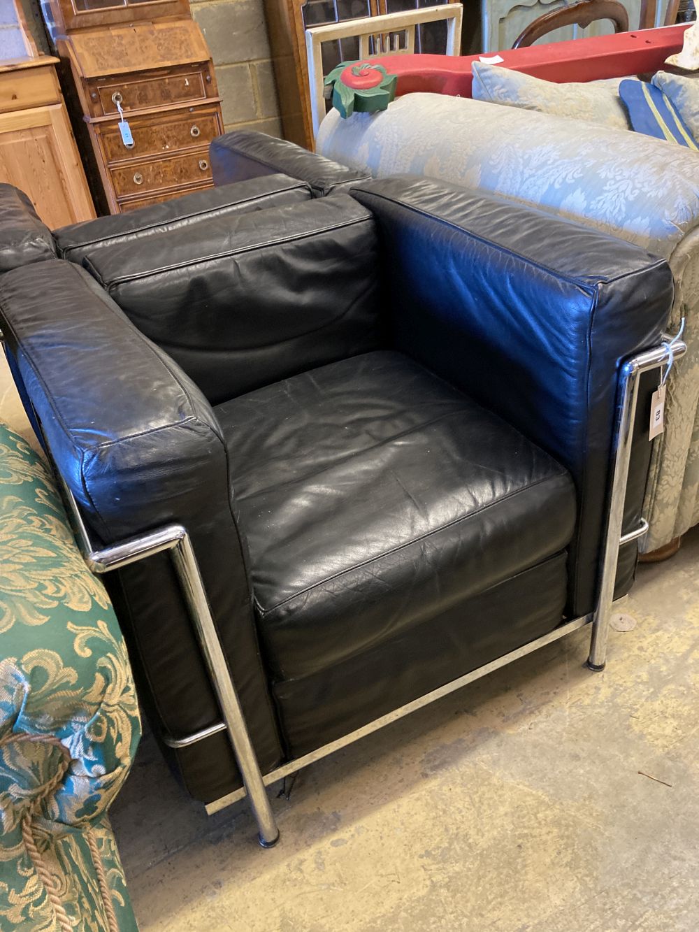 A pair of Le Corbusier style leather and chrome chairs, width 76cm, depth 70cm, height 65cm